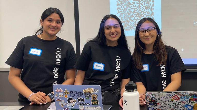 Student organizers pose at hackathon